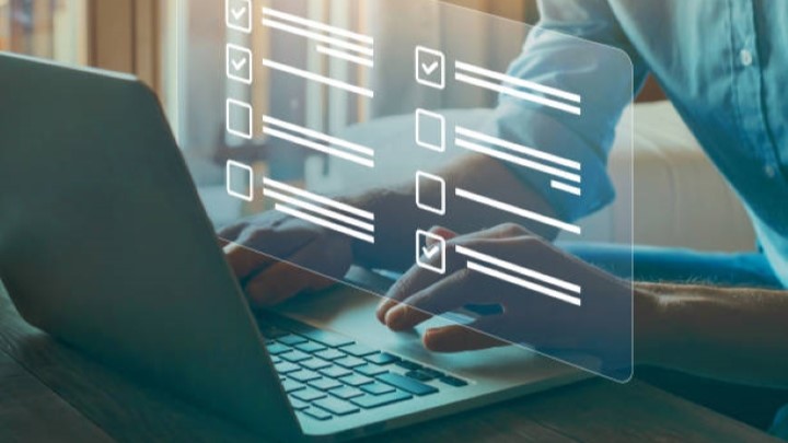 Person filling out a form on a computer